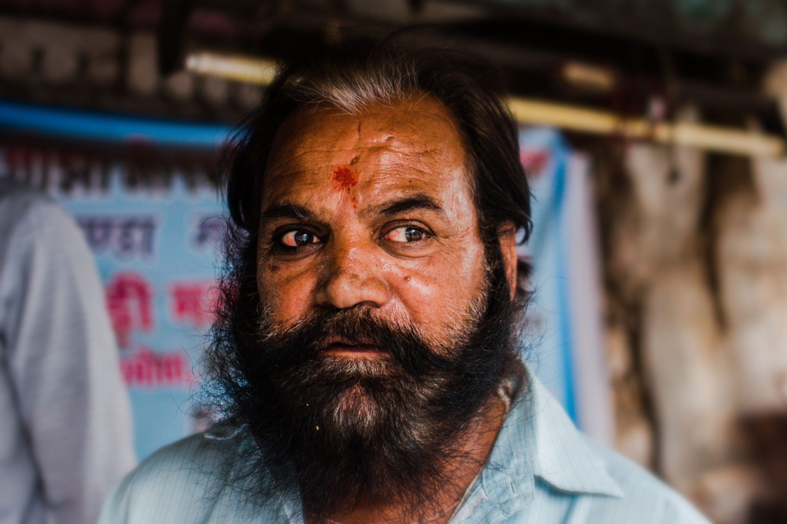 Close-up portrait of a bearded Indian man with a traditional mark on his forehead, Bikaner.